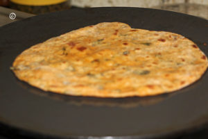 mint paratha being cooked