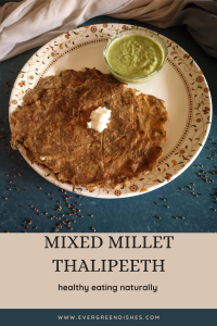 Multi millet thalipeeth served with a dollop of butter and green chutney.