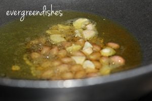 ground nuts, cashew pieces and curry leaves
